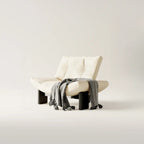 Fauteuil d'appoint contemporain noir en chenille capitonnée sans accoudoirs