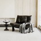 Fauteuil d'appoint contemporain noir en chenille capitonnée sans accoudoirs