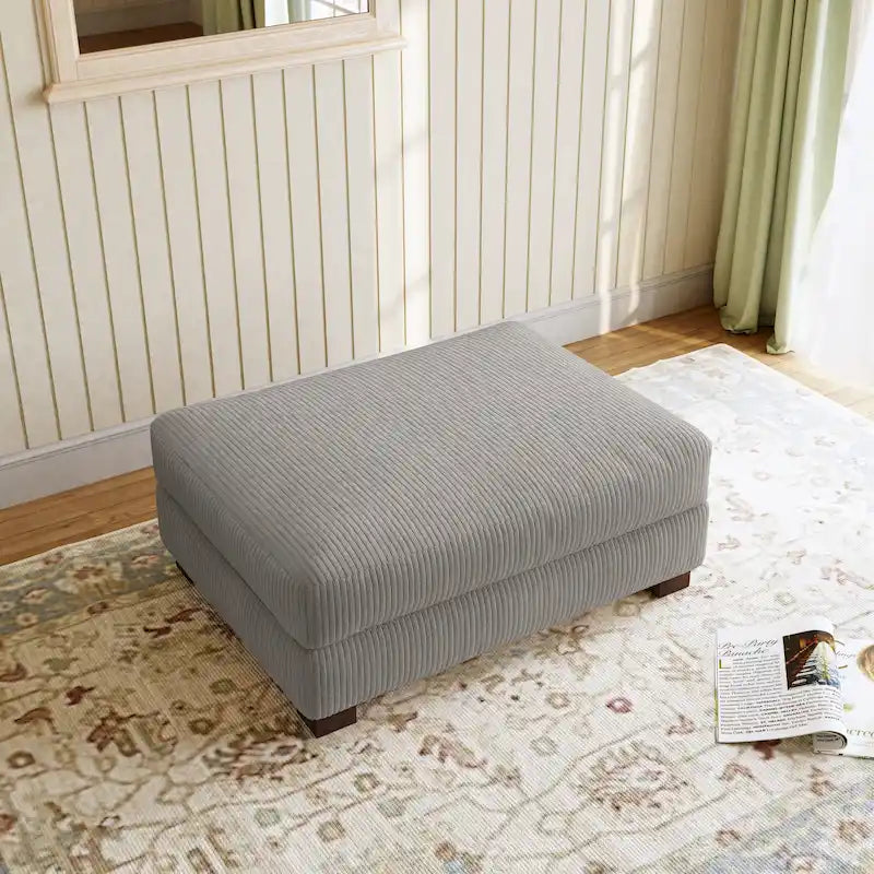 Grand pouf décoratif moderne en velours côtelé