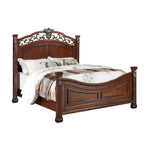 Holzbett mit kunstvoll gestaltetem Kopfteil in dunkler Kirschholzoptik